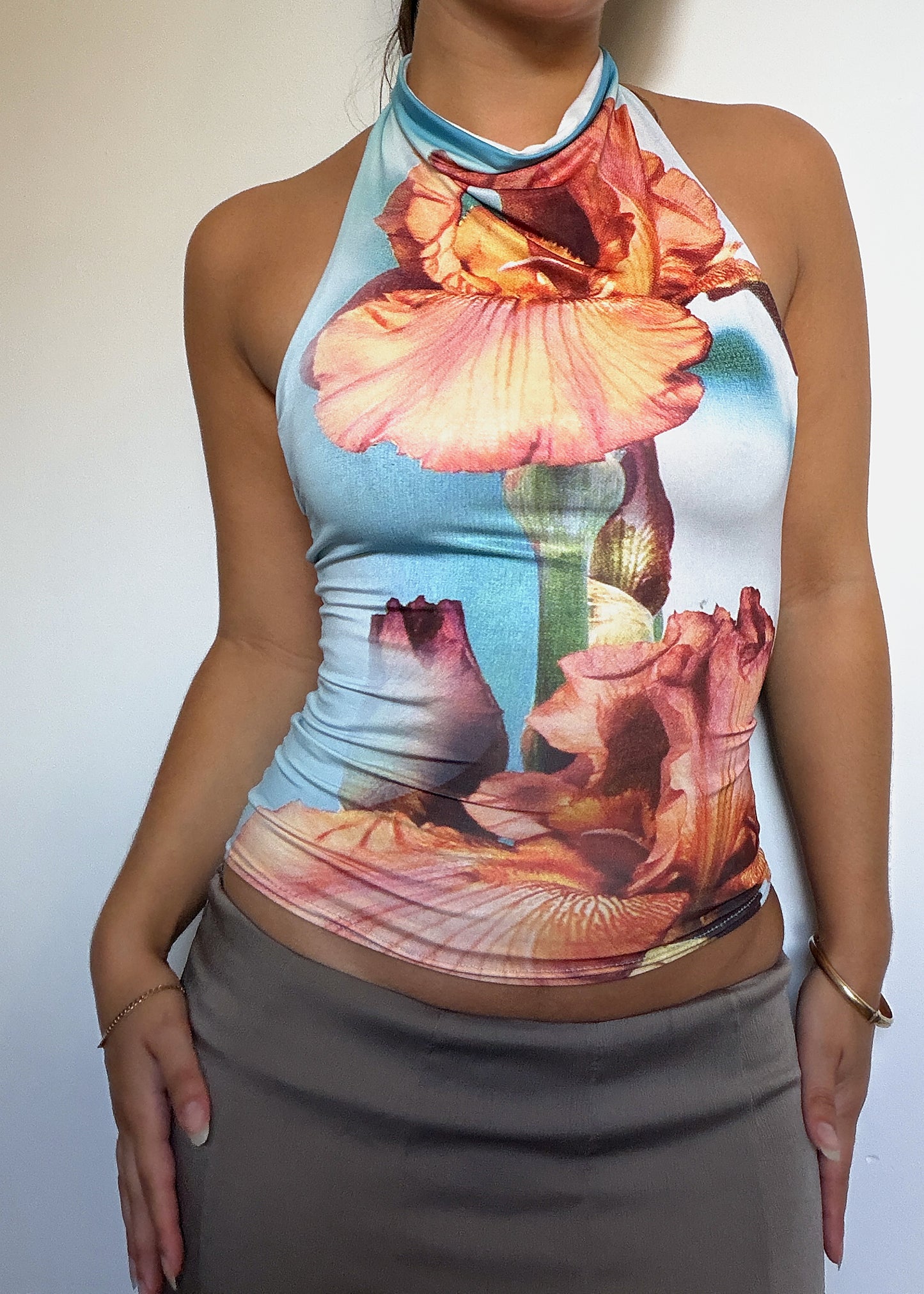 The Roma in Iris - backless halter top in a peach iris print on aqua, front view